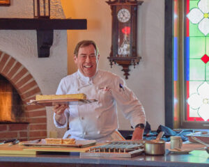 Chef Jacques presents a dish at one of his cooking demonstration!